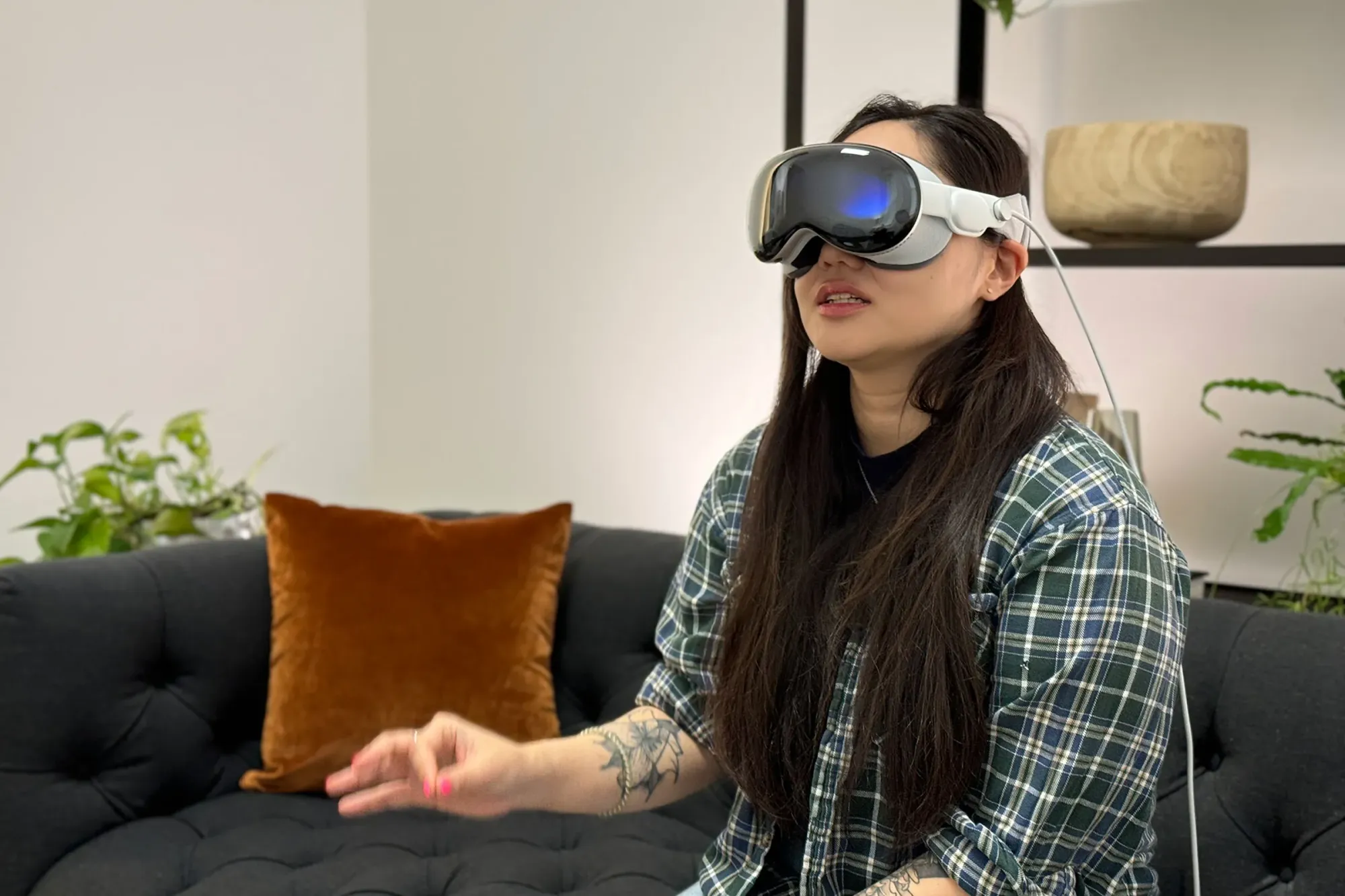 Person wearing Apple Vision Pro while pinching